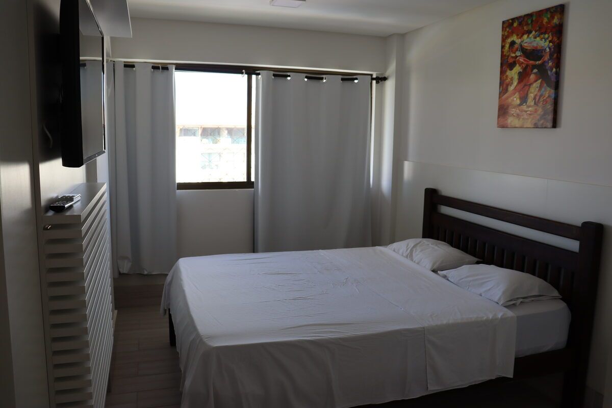 Quarto aconchegante com cama de casal e ar-condicionado